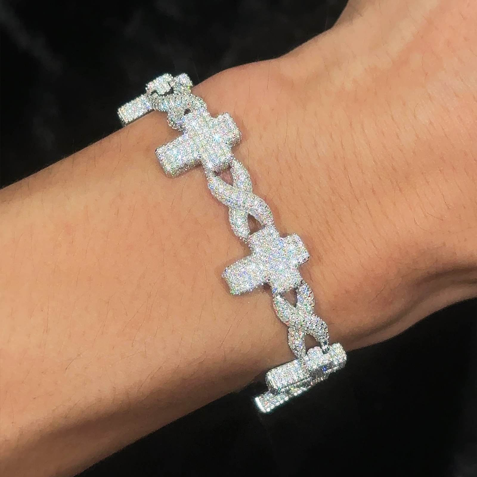 a-infinity-cross-link-bracelet-worn-on-a-man's-hand