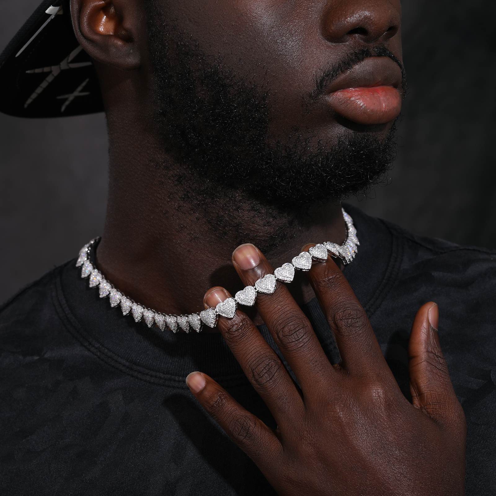 a-black-man-is-holding-a-tennis-chain